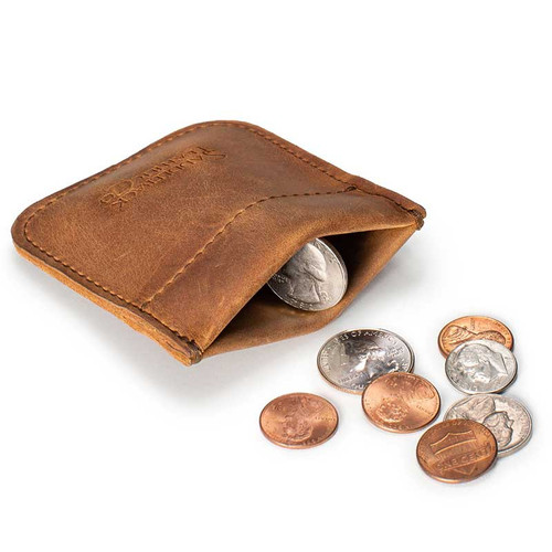 This is a tan brown leather coin purse that has change spilling out in front of the pouch.