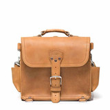 This is the front view of a tan brown rounded leather satchel.