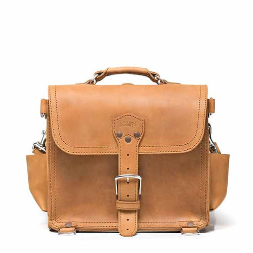 This is the front view of a tan brown rounded leather satchel.