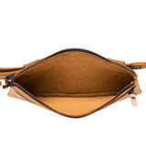 This leather belt bag in light tan is showing the inside view