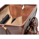 This is the top of a dark brown leather briefcase that is wide open so lawyers can get things out.