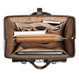 This dark brown leather briefcase is wide open and full of laptops and other things for lawyers.