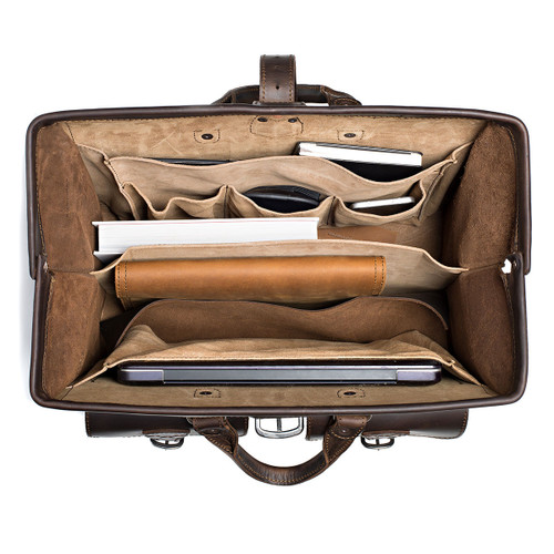 This dark brown leather briefcase is wide open and full of laptops and other things for lawyers.