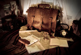 This is a dark brown full grain leather briefcase during planning out a trip.