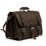 This is the front view angled of a large dark brown full grain leather briefcase.