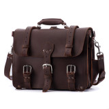 This is the front view of a large red brown full grain leather briefcase that is a classic one.