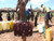 This is a red brown full grain leather briefcase at a well in Uganda.