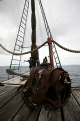 This is a dark brown full grain leather briefcase on a ship.