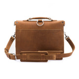 This is the back of a light tan brown leather briefcase with front pockets on the other side.