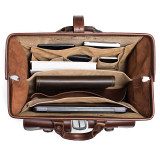 This is a red brown leather lawyers briefcase from the top view when it is wide open.