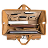 This wide open light brown leather briefcase is really wide open and full of professional things.