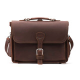 This is a slim red brown leather briefcase staring straight into the camera.