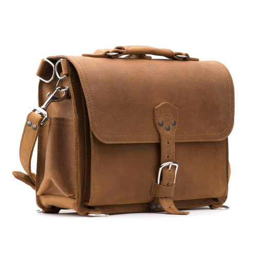 This is a tan brown leather briefcase with a flap over the front.