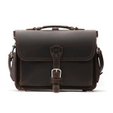 This is a dark brown slim leather briefcase staring straight into the camera.