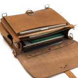 This is the light brown leather briefcase laying down with the flap open.