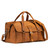 This is a tan brown leather duffle bag that has three straps to close it and has two round handles from the front side.