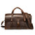 This is a red brown leather duffle bag that has three straps to close it and has two round handles from the front straight on.