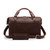 This is the back of a red brown leather duffle bag with a gladstone bag closure.