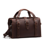 This is a red brown overnight leather duffle bag with a gladstone closure from the front view.