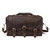 This is a dark brown leather duffle bag with three straps on the front and it is facing the camera. It has a travel overnight handle on top.
