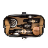 This is a black leather toiletry bag on the opened and loaded.