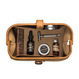 This is a tan brown leather toiletry bag on the opened and loaded.