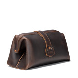 This is a dark brown leather toiletry bag on the back side.