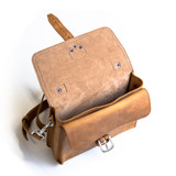 This is the front side of a tan brown leather satchel with a front pocket below.