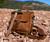 This is a tan leather satchel that is known as the Indiana Satchel. We would call it the Indiana Jones Satchel but we would get sued. It is the exact dimensions of his man bag.