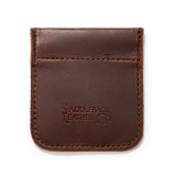 This is the front of a red brown leather coin purse used for change.