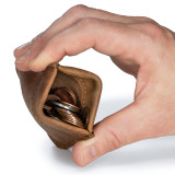 This is a tan brown leather coin purse that has change inside.