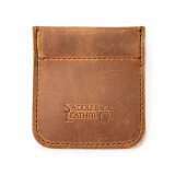 This is the front of a tan brown leather coin purse used for change.