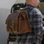 This is a leather briefcase used as a laptop backpack.