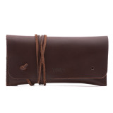 This is a red brown leather wallet bag with a wrap around it to close it from the front.