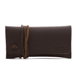 This is a dark brown leather wallet bag with a wrap around it to close it from the front.