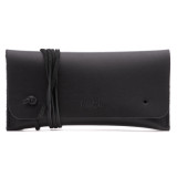 This is a black leather wallet bag with a wrap around it to close it from the front.