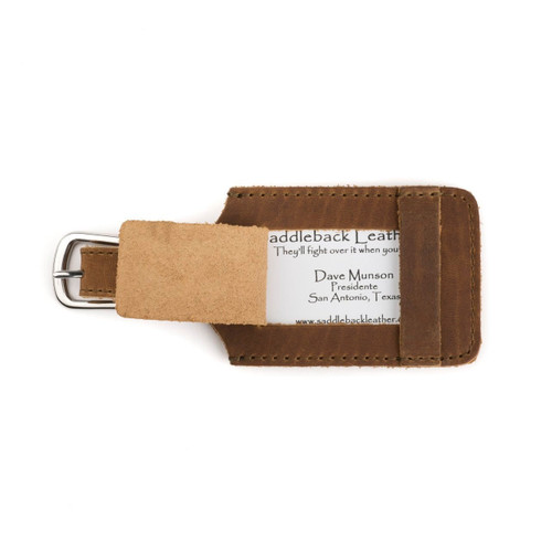 This is a tan brown leather luggage tag that is open to  be an ID Badge Holder.