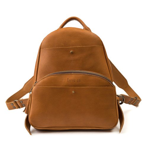 This is a tan brown women's leather backpack from the front side.