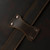 This is a leather trunk that will be a vintage antique one day in a museum. This is the leather pass through for the strap. It is a dark brown steamer trunk that was old time luggage back in the day on trains and ships.