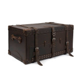 This is a leather trunk that will be a vintage antique one day in a museum. This is the front angled side. It is a dark brown steamer trunk that was old time luggage back in the day on trains and ships.