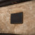 This is a leather trunk that will be a vintage antique one day in a museum. This is the leather tag on the inside. It is a dark brown steamer trunk that was old time luggage back in the day on trains and ships.