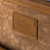 This is a leather trunk that will be a vintage antique one day in a museum. This is the leather tag on the inside. It is a tan brown steamer trunk that was old time luggage back in the day on trains and ships.