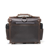 This is the back view  of a dark brown rounded leather satchel.