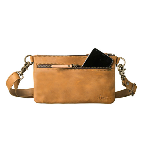 This light tan colored leather belt bag is showing the front view