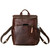 This is the front view of the leather all in one backpack in chestnut showing a device in the pocket