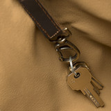 This is the key clip view of the leather all in one backpack in dark coffee