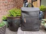 This is a lifestyle image of the all in one leather backpack in black