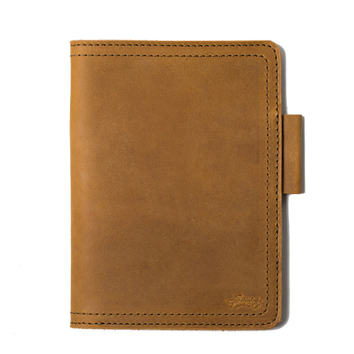 The front of the medium leather moleskine cover has a pen holder and full-grain leather that will outlast you. Made by Saddleback