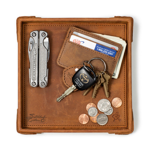 This leather catchall valet tray can hold a lot. Especially this tan brown one.