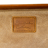 Grandfather Collection patch on carry-on suitcase.